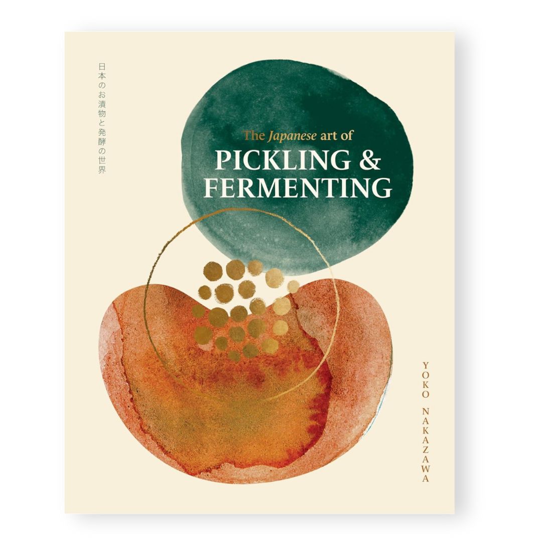 Book cover of 'The Japanese Art of Pickling & Fermenting' with a stylized fruit and green circle on a beige background.