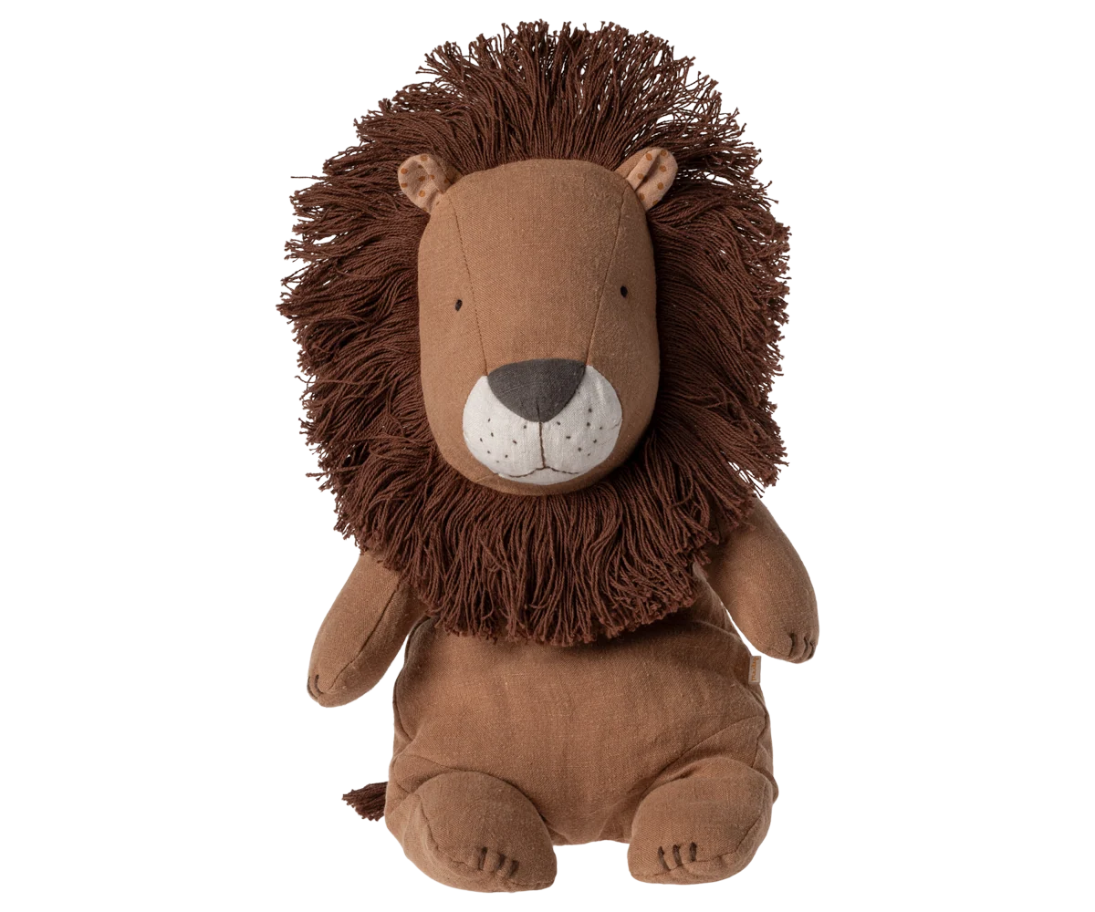 Brown plush lion toy on a white background